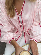 V-Neck Pleated Twist-Detail Blouse