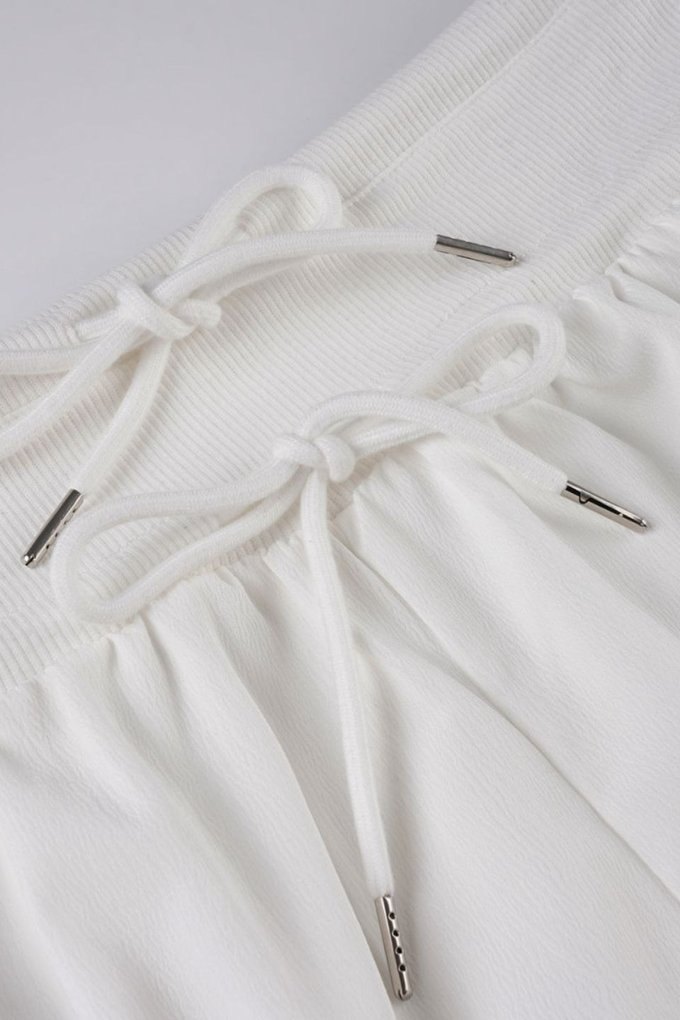 Low-Rise Bodycon Ruffled Shorts with Drawstring Detail